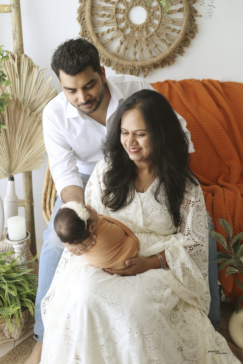 Family portrait in a warmly lit studio