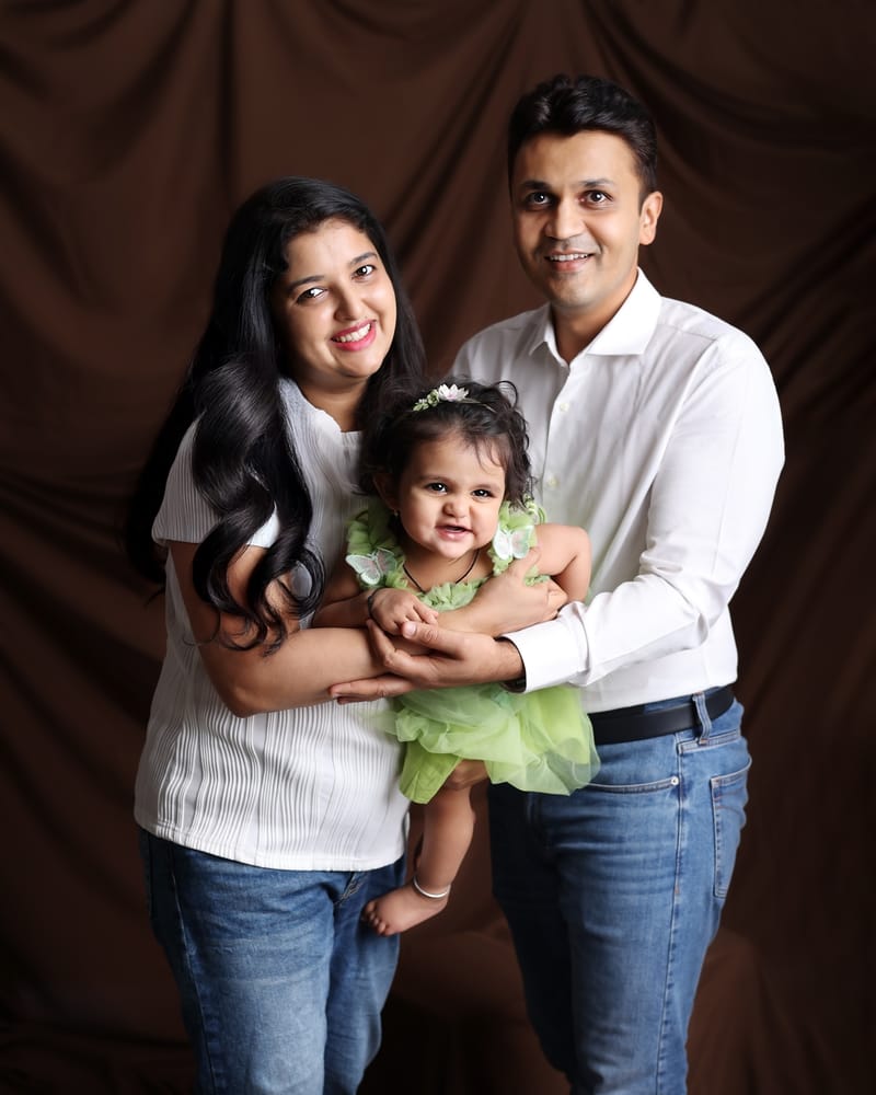 Family of three sharing a loving moment