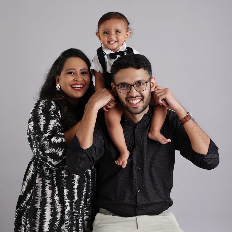 Studio family session with coordinated outfits