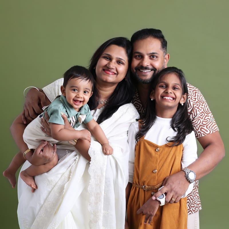 Mother and father with baby in studio