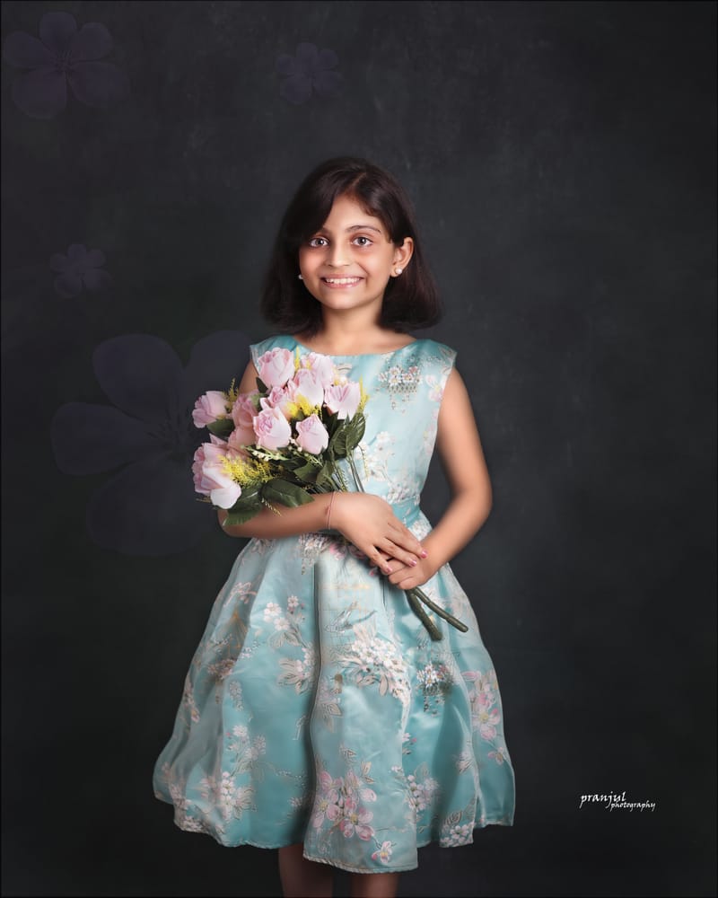 Child in traditional outfit studio photography