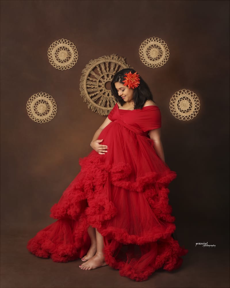 Maternity portrait in studio with elegant draping