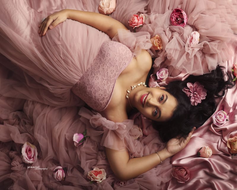 Expecting mother in flowing gown