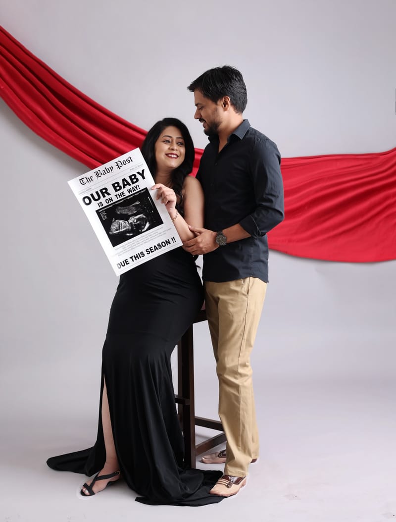Expecting mother in designer maternity gown