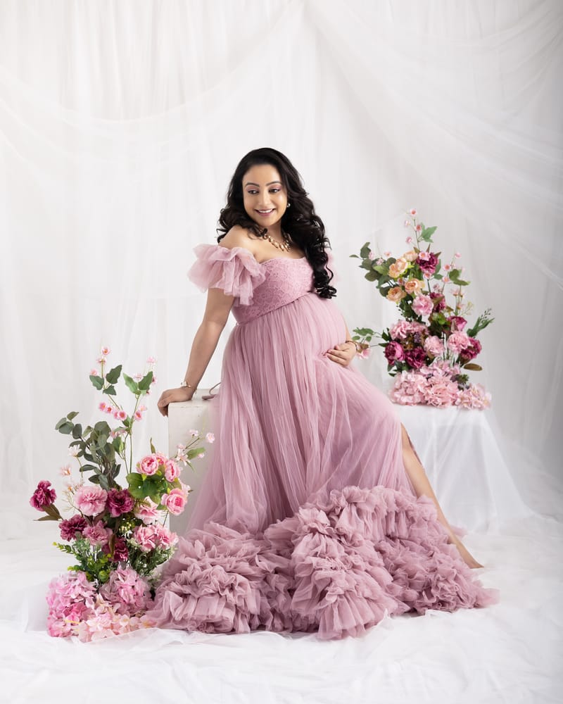 Expecting parents in coordinated outfits