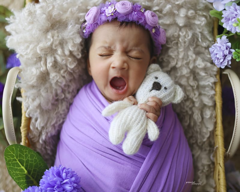 Newborn portrait with soft knit blanket
