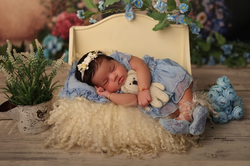Creative newborn photography with miniature props