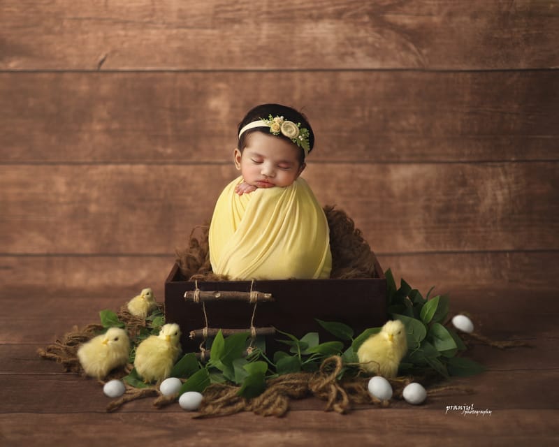 Close-up newborn portrait with serene expression