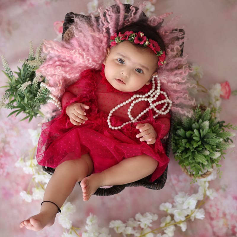 Toddler milestone photoshoot with cake smash setup