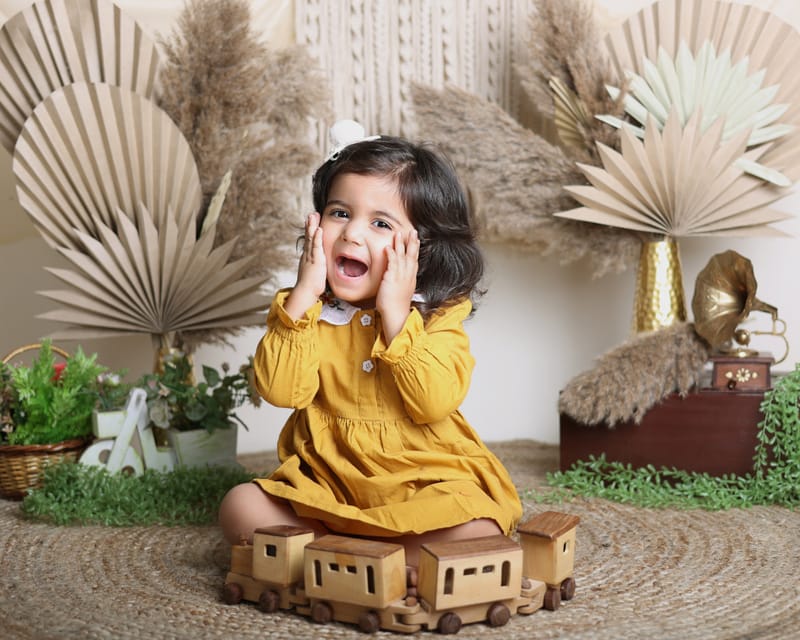 Toddler standing in a minimalist portrait setup